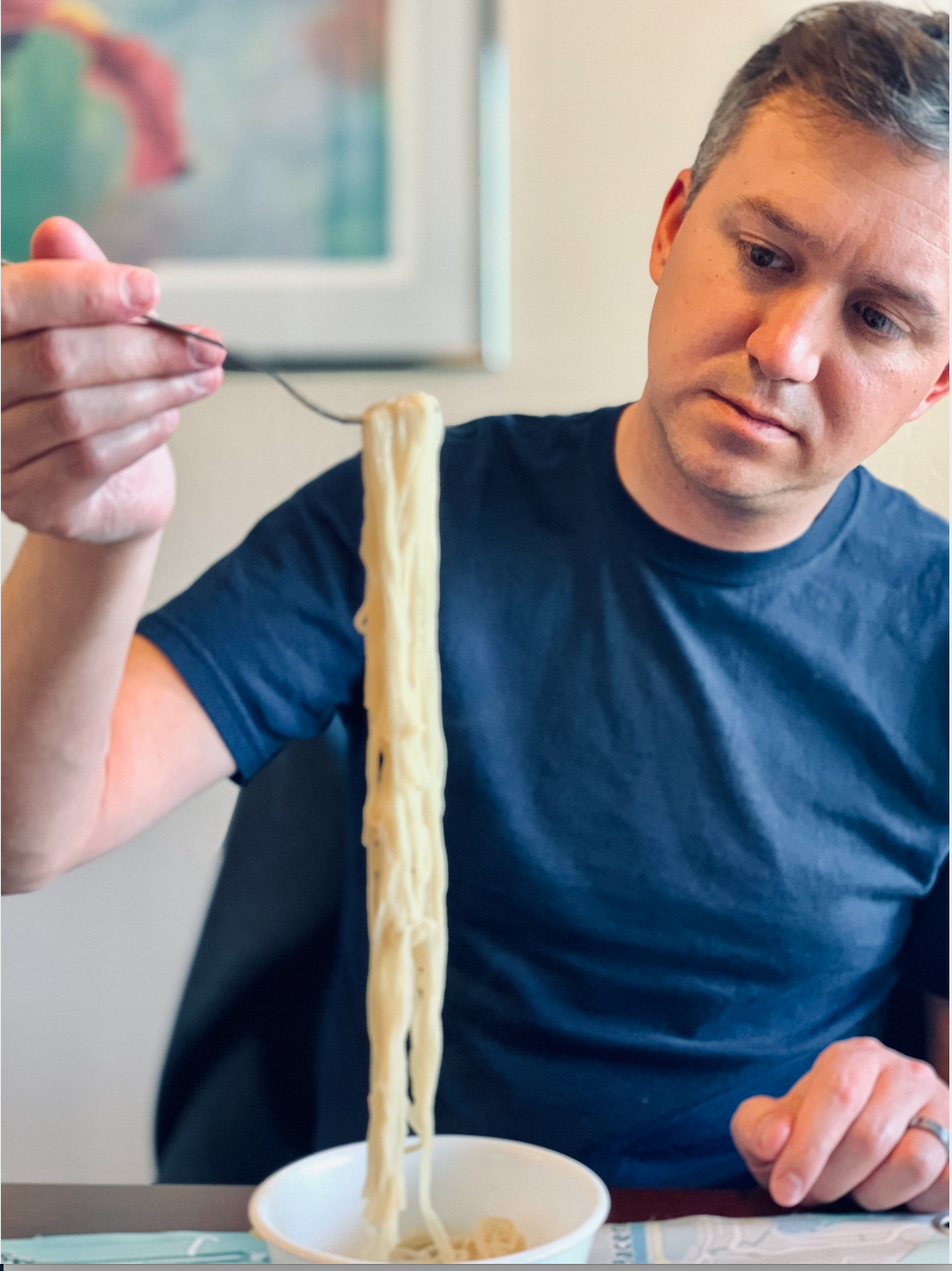 Dan inspecting noodles